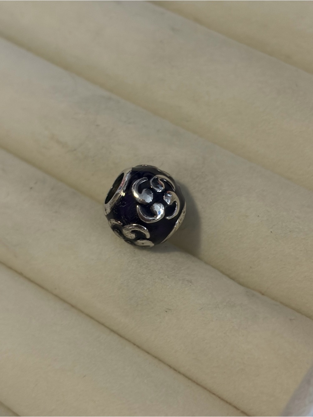 retired Pandora Zen charm made of sterling silver and purple enamel